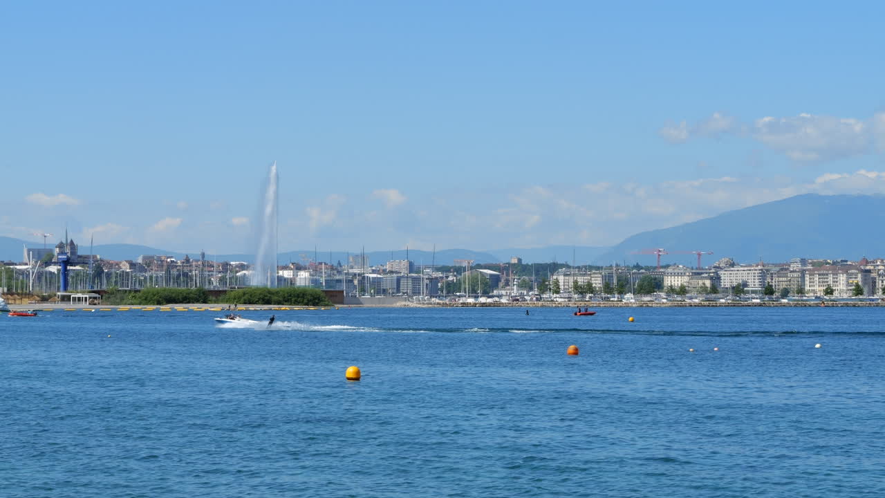 Person wake surfing at lake Geneva, Switzerland. Static view at day time