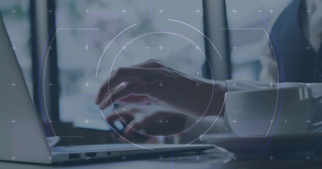 Businessman typing on laptop for data entry with HUD overlay tracking smartphone taps