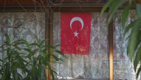 turkish flag hanging from a window