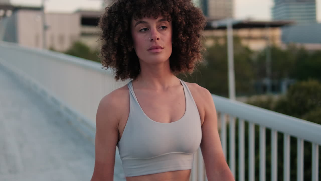 Fit Woman on City Bridge