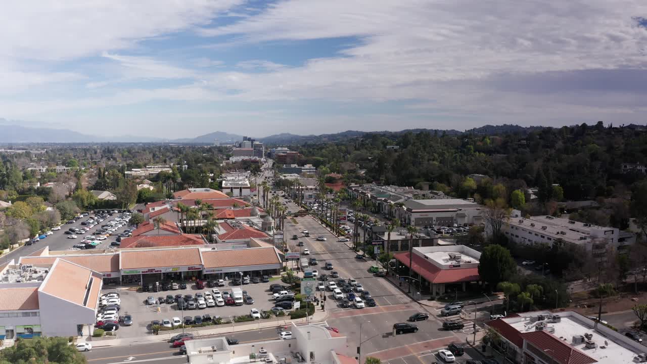 Aerial wide rising shot of Ventura Blvd. in Encino, California. 4K