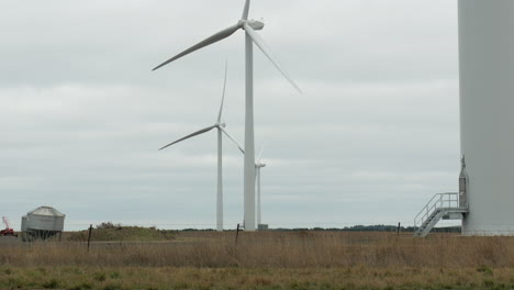 wind turbines on australian farmland. pan up shot