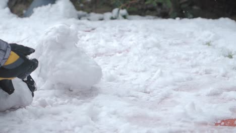 child building a snowman