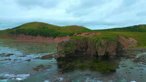 rocky coastline with islands and hills