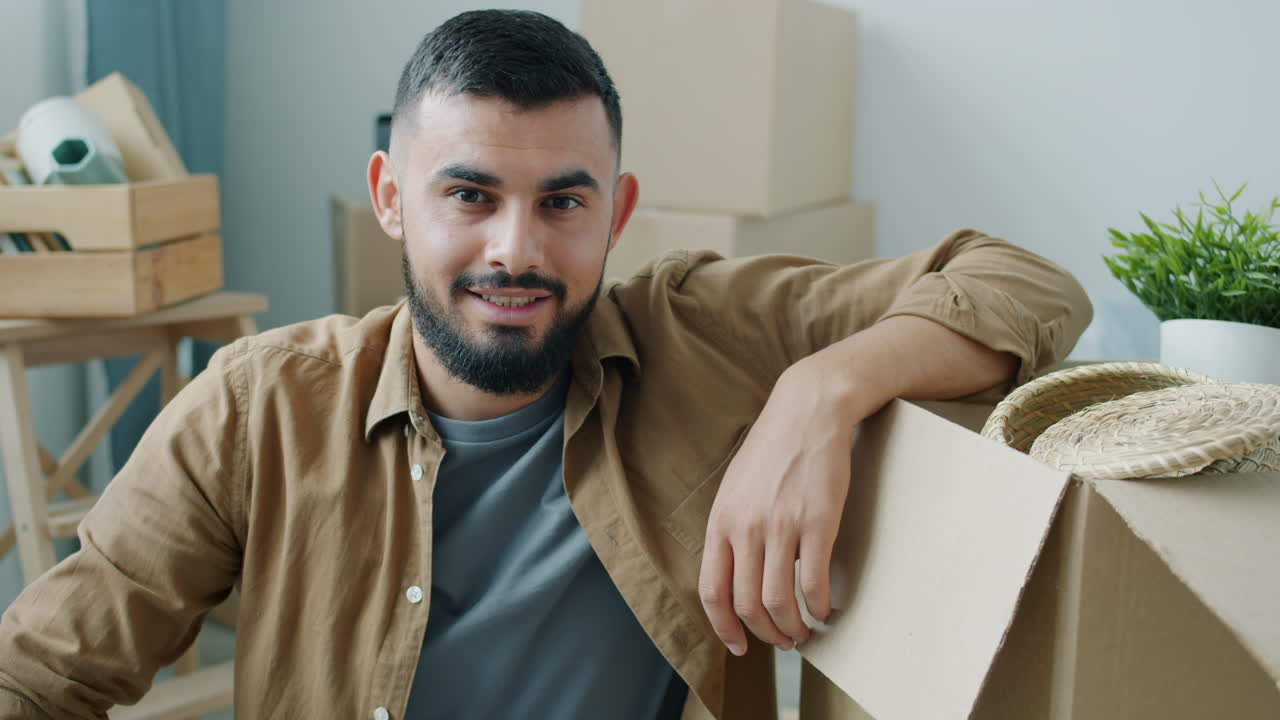 Man smiling while moving house