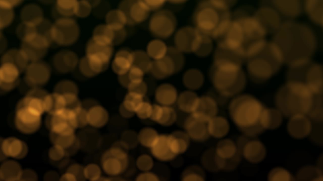 Orange abstract lights bokeh out of focus background. Abstract Circle lights Blur background. Defocused glowing dots background. Elegant, detailed, and delightful bokeh and particles visuals