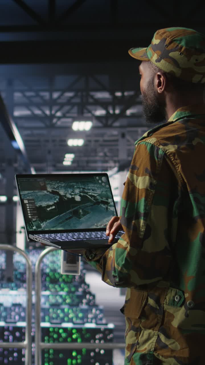 Vertical video Soldier in server room uses geospatial data to support emergency operations