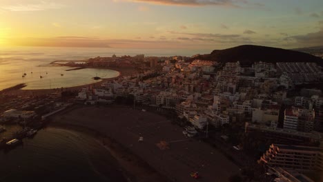 amazing establishing shot aerial view of los cristianos city in tenerife, canary