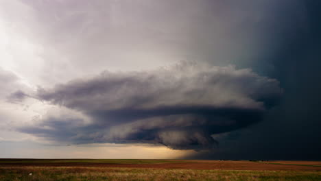 dramatic supercell thunderstorm over expansive fields
