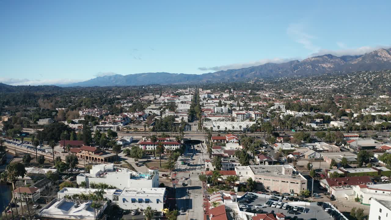 Wide rising aerial shot of downtown Santa Barbara along State Street in Southern California. 4K