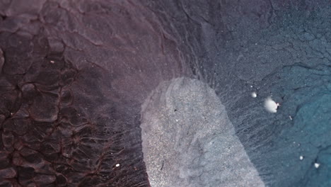 swirling liquids create mesmerizing patterns in this macro view of fluid dynamics