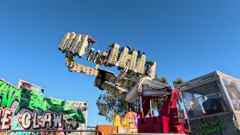 dynamic amusement ride swings with excited passengers