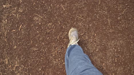 man walking on the ground with sneakers, doing sports