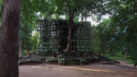 camera pulls in to stone prasat linga at koh ker temple in cambodia