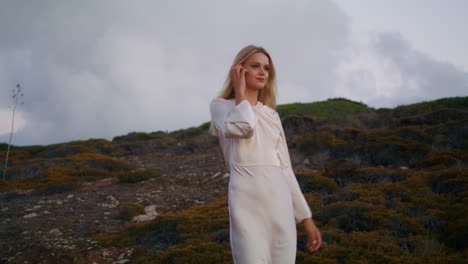 tender tourist crossing hill closeup. joyful lady enjoying sunset environment