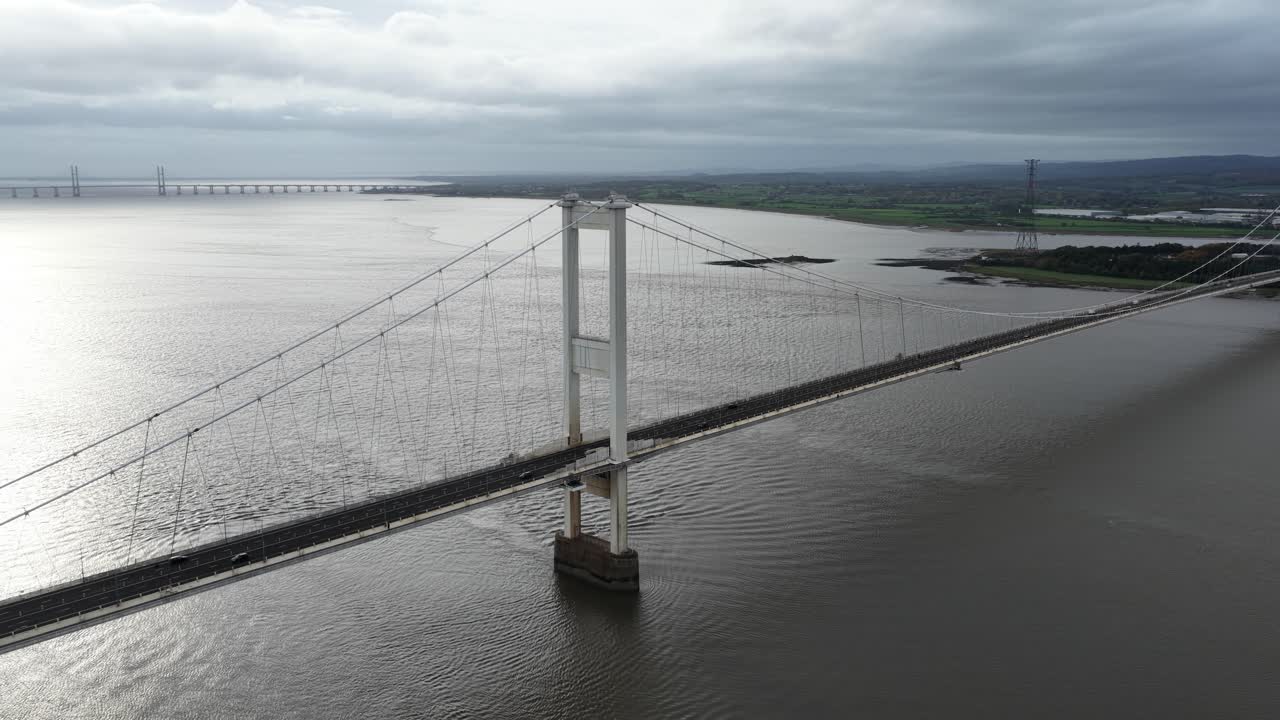 Aerial view of the Severn Bridge (Pont Hafren), the historic motorway suspension bridge connecting England and Wales, showcasing its engineering design, river crossing, and transport significance