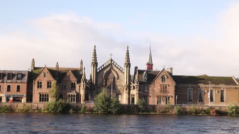 quaint-european-street-along-the-river-ness-in-Inverness,-Scotland-in-the-Highlands