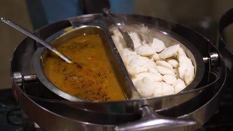 view of idly and sambar kept side by side in wedding.