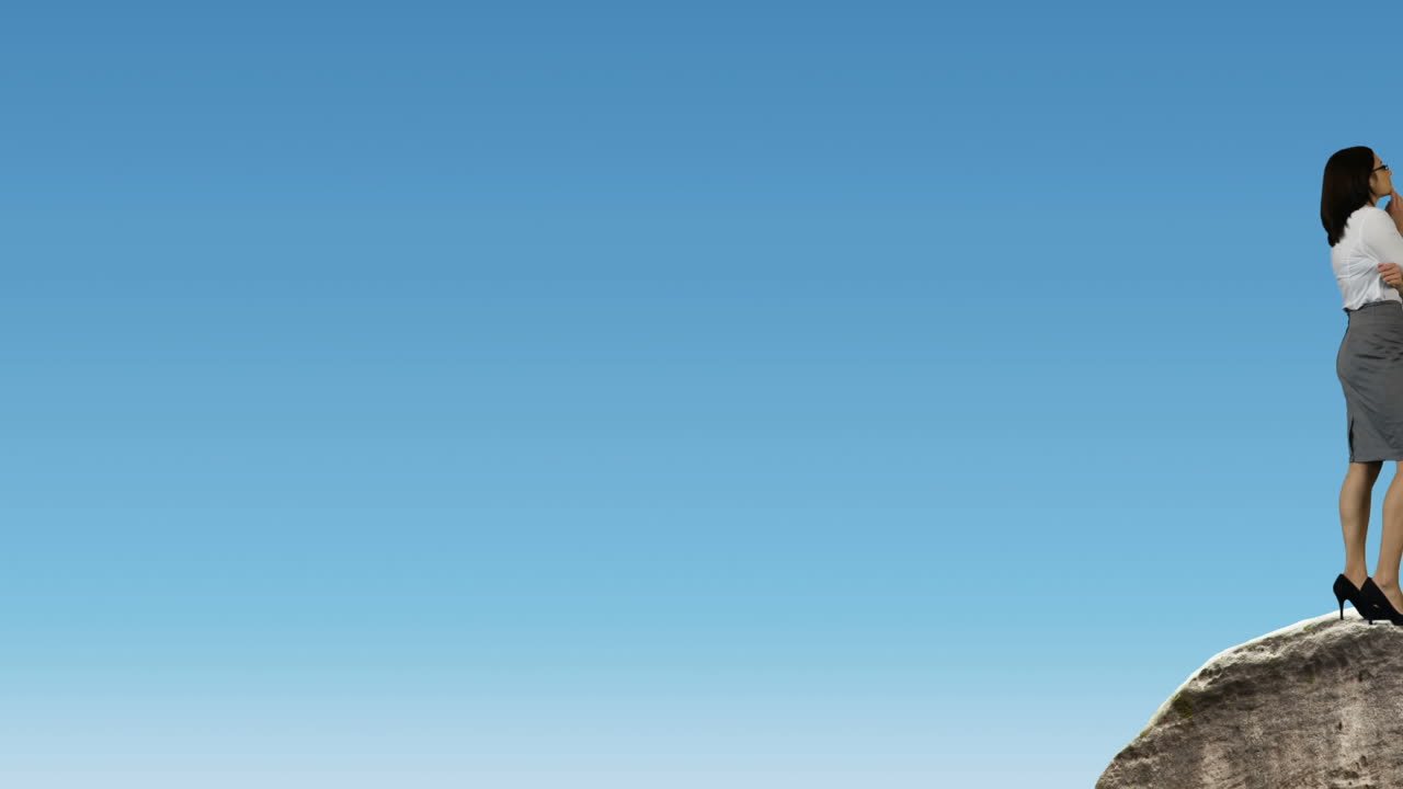 바위 위 에 서 있는 사업가 와 여성 이 바 을 바라보고 있다