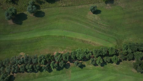 Aerial-Birds-Eye-View-Flying-Overhead-Green-Golf-Course-Fairway