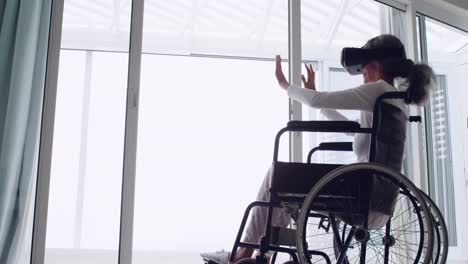 mature woman in a wheelchair using vr