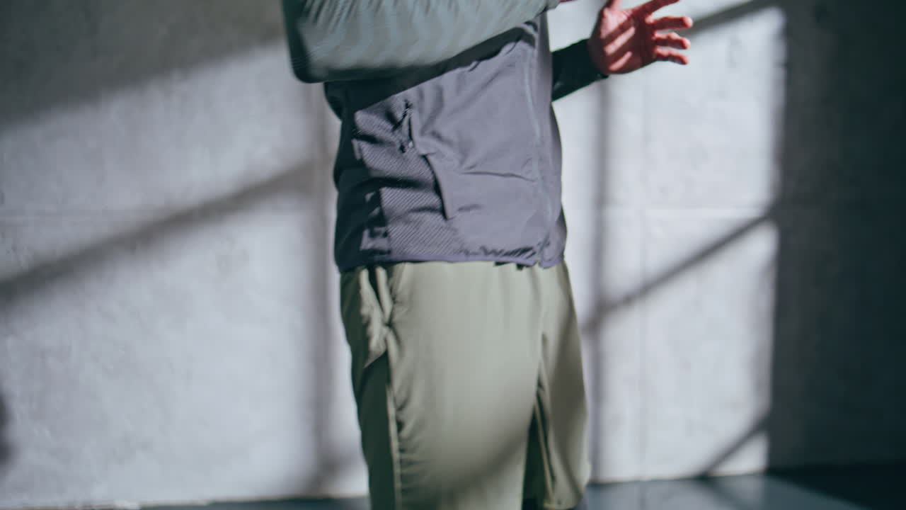 Boxer man warming legs on gym training closeup. Unrecognizable athlete jumping