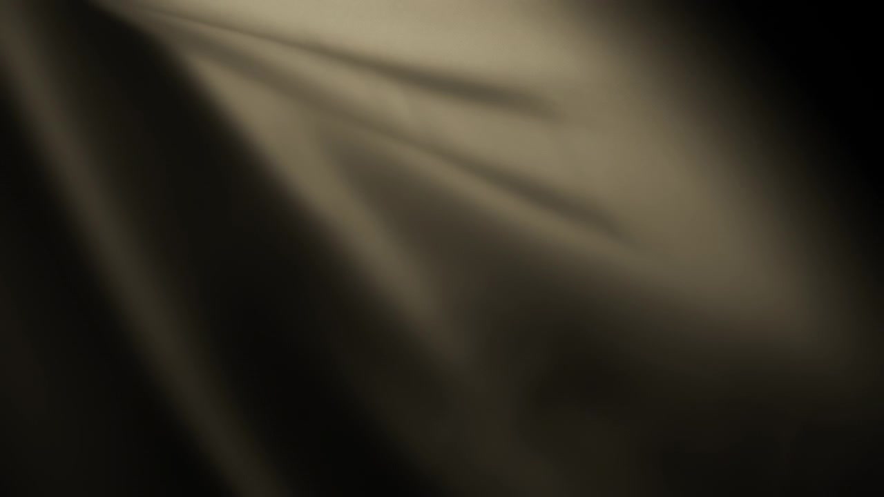 Abstract background of dark beige chiffon fabric waving in the wind