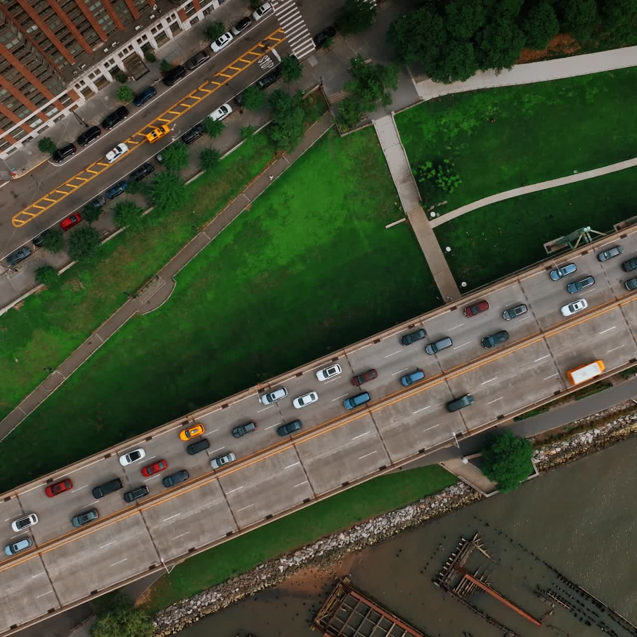 View of the two-way road with multiple cars moving by. One of the highways in New York from top
