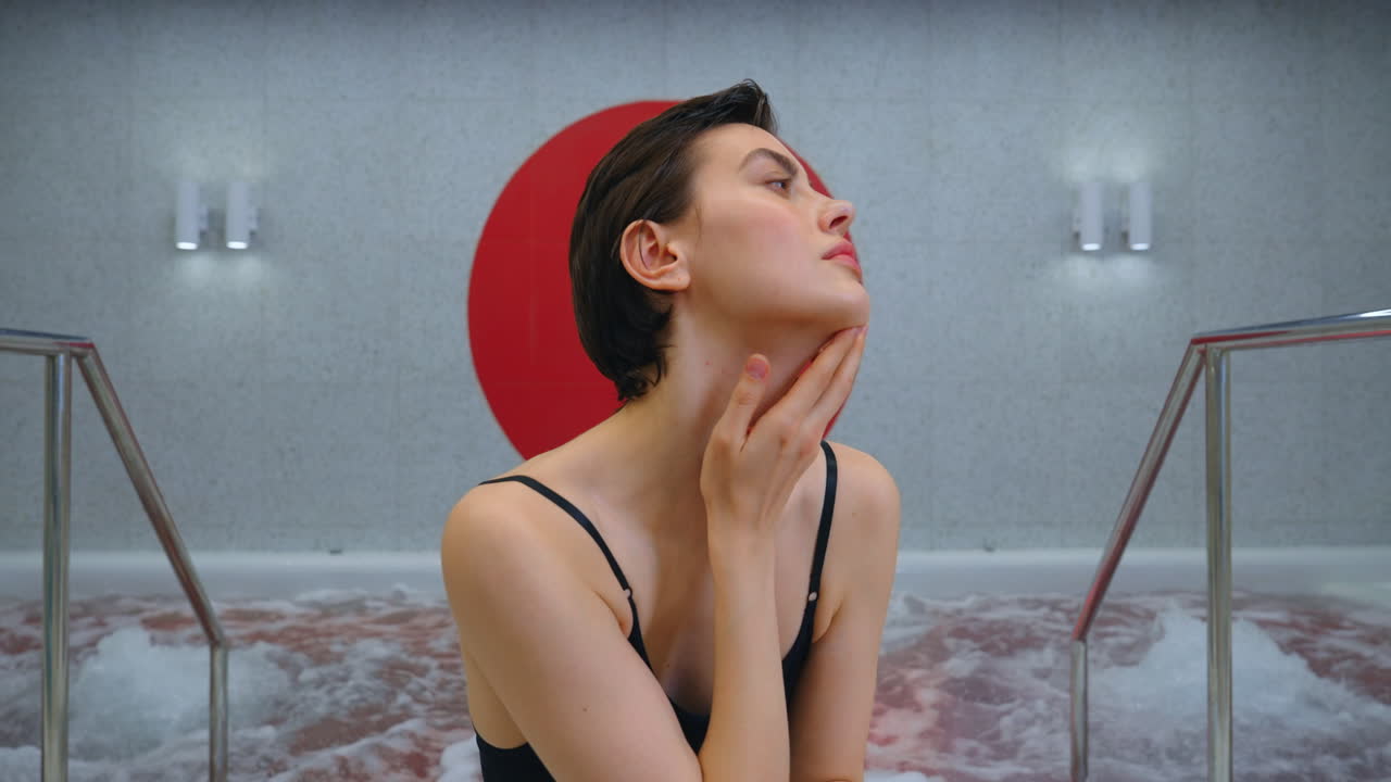 Woman relaxing in a hot tub spa