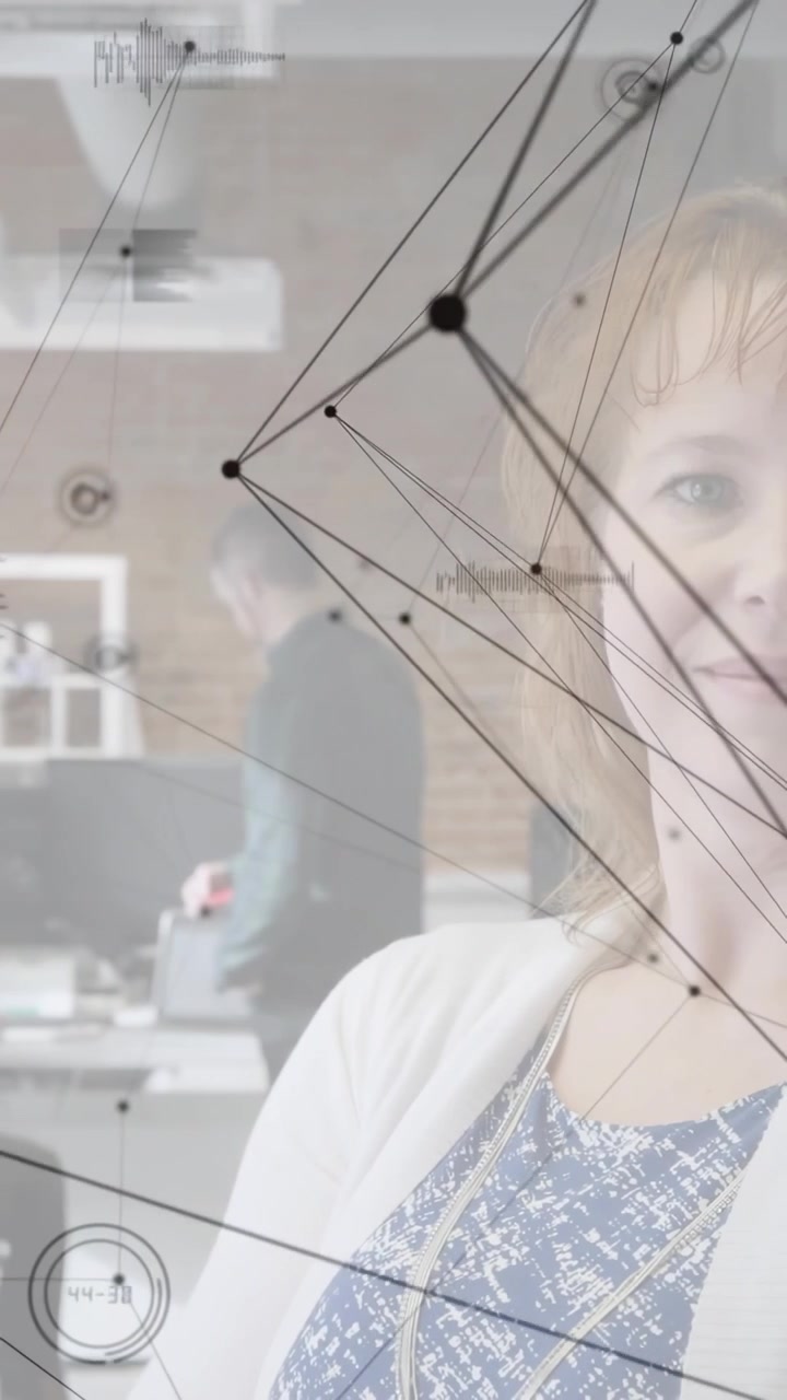 Vertical video: Woman in office camera panning nodes aligning to face as peer passing showing data