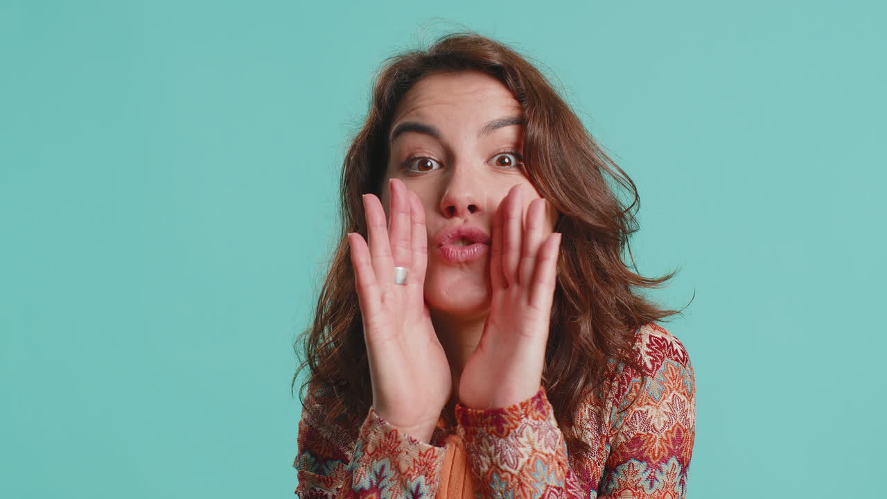 Young woman whisper news rumors holding hands near mouth share gossip quiet keep my secrets