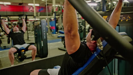 muscular man actively training in the modern gym