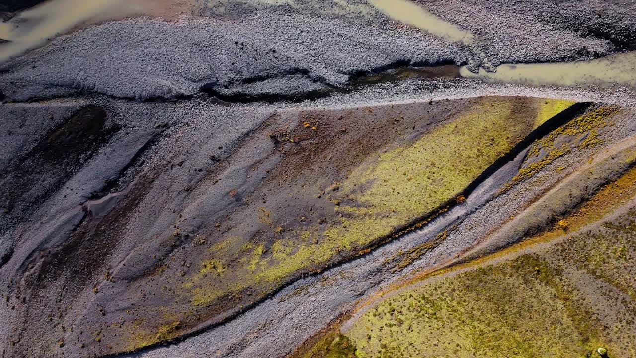 Icelandic streams twist like veins on their journet through glaciated valleys, volcanic rock and mossy green flatlands creating textures as it travels to the sea. Drone