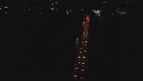 cars in heavy lagos traffic at dusk through till night