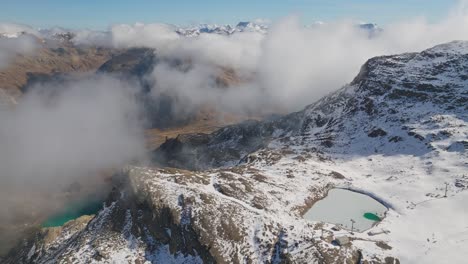diavolezza glacier ski resort in high swiss alps on sunny day, drone shot