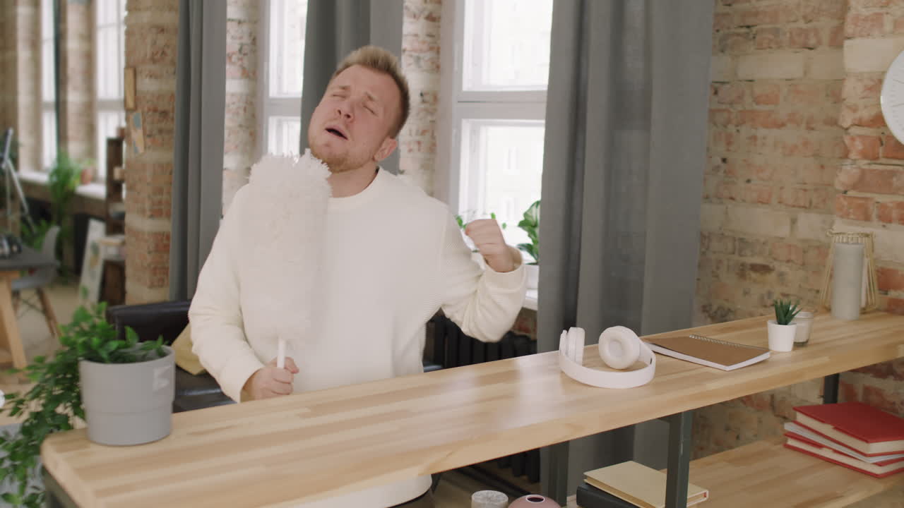 Carefree Man Dusting and Singing