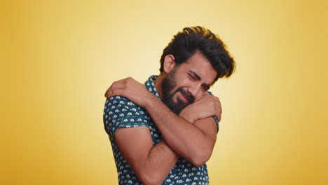 Indian-bearded-man-spread-hands-and-give-hug-embrace-to-you,-pleasant-expression-love-happy-feelings