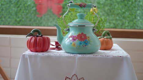 decorative turquoise teapot on a table