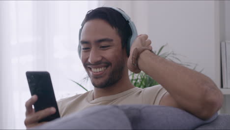 Happy-man-listening-to-music-with-headphones