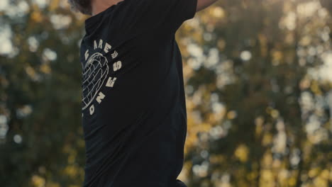 young man playing basketball outdoors