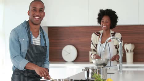 happy young couple cooking together