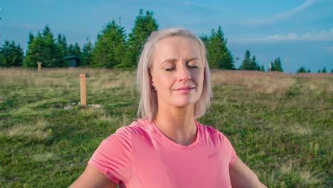 slow motion orbit of a young woman with grateful expression connecting with nature