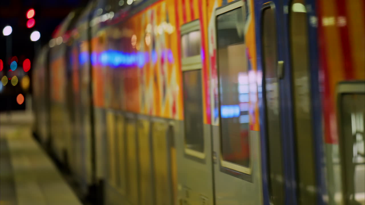 Nice, France - February 4, 2025: Train moving on the rails arriving at the Nice Ville Central train station in the evening