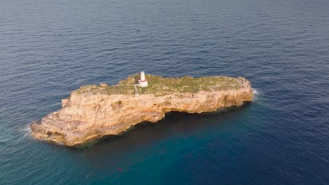 Aerial-view-of-limestone-Punta-de-El-Toro-formation-in-turquoise-water,-Spain