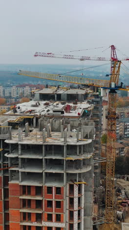 construction of a residential apartment complex. aerial view. vertical video