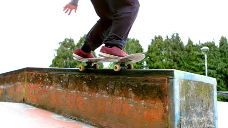 Young-skateboarder-skating-the-outdoor-skatepark