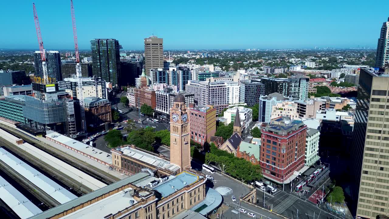 Drone aerial landscape of Sydney's Central city train station in Sydney with clock tower Haymarket Surry Hills Belmore Park CBD urban buildings skyline