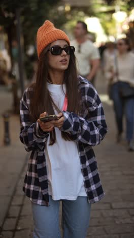 stylish young woman walking on the street