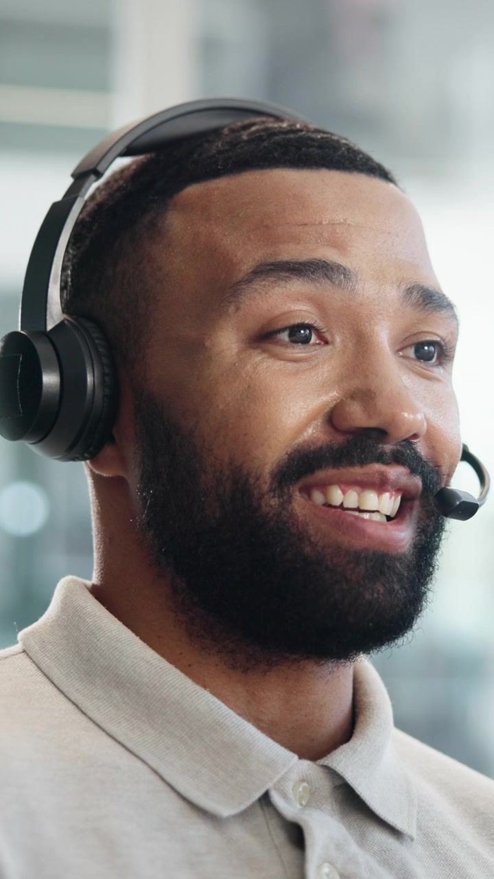 Friendly Customer Service Representative Wearing Headset Talking in Office