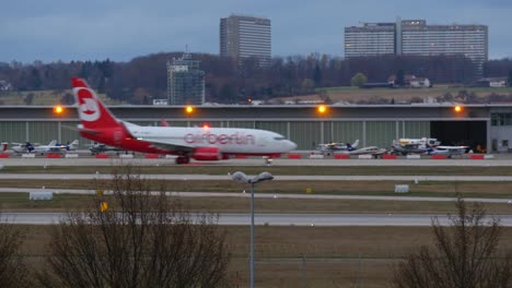 airport scene at dusk with airberlin jet